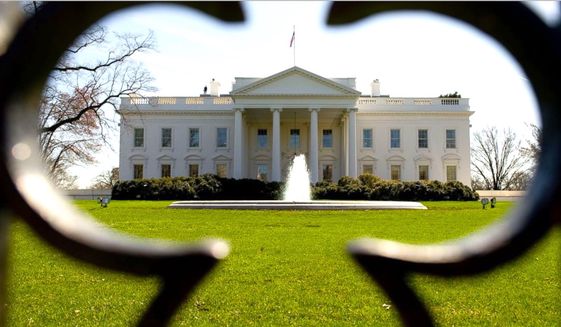 The White House, as seen through an exterior security fence. (AP PHOTO, file)