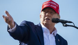 Former President Donald Trump speaks from the podium during a campaign rally for Nebraska Republican gubernatorial candidate Charles Herbster, Sunday, May 1, 2022, in Greenwood, Neb. (Kenneth Ferriera/Lincoln Journal Star via AP) **FILE**