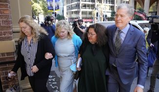 Steve Johnson, right, with his sisters, Terry, left, and Rebecca and his wife Rosemarie, second right, arrive at the Supreme Court in Sydney, Monday, May 2, 2022, for a sentencing hearing in the murder of Scott Johnson — Steve, Terry and Rebecca&#x27;s brother. Scott White appeared in the New South Wales state Supreme Court for a sentencing hearing after he pleaded guilty in January to the murder of the Los Angeles-born Canberra resident Scott Johnson, whose death at the base of a North Head cliff was initially dismissed by police as a suicide. (AP Photo/Rick Rycroft)
