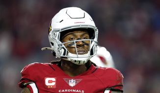 Arizona Cardinals wide receiver DeAndre Hopkins looks to the sideline during a timeout in second half of an NFL football game against the Los Angeles Rams, Dec. 13, 2021, in Glendale, Ariz. Cardinals three-time All-Pro receiver Hopkins has been suspended six games for violating the NFL’s policy on performance-enhancing substances. (AP Photo/Ralph Freso, File) **FILE**