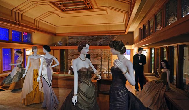A scene staged by film director Martin Scorsese featuring fashions by designer Charles James and a room by architect Frank Lloyd Wright is displayed as part of the Met Museum Costume Institute&#x27;s exhibit &amp;quot;In America: A Lexicon of Fashion,&amp;quot; Saturday, April 30, 2022, in New York. (Photo by Charles Sykes/Invision/AP)