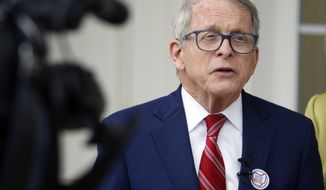 Ohio Gov. Mike DeWine talks with reporters outside of his polling place after voting in Cedarville, Ohio, Tuesday, May 3, 2022. (AP Photo/Paul Vernon)