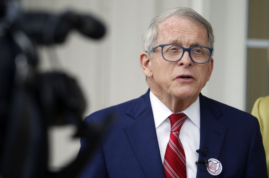 Ohio Gov. Mike DeWine talks with reporters outside of his polling place after voting in Cedarville, Ohio, Tuesday, May 3, 2022. (AP Photo/Paul Vernon)