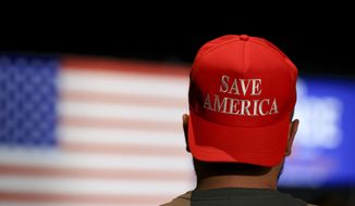 A supporter wears a Save America hat during an election night watch party, Tuesday, May 3, 2022, in Cincinnati. JD Vance won Ohios contentious and hyper-competitive GOP Senate primary, buoyed by Donald Trumps endorsement  in a race widely seen as an early test of the former presidents hold on his party. (AP Photo/Aaron Doster)