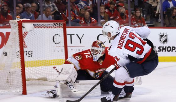 Washington Capitals center Evgeny Kuznetsov (92) scores against Florida Panthers goaltender Sergei Bobrovsky (72) during the third period of Game 1 of an NHL hockey first-round playoff series Tuesday, May 3, 2022, in Sunrise, Fla. (AP Photo/Reinhold Matay) **FILE**