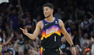 Phoenix Suns guard Devin Booker (1) reacts to a play against the Dallas Mavericks during the second half of Game 1 in the second round of the NBA Western Conference playoff series Monday, May 2, 2022, in Phoenix. (AP Photo/Matt York) **FILE**