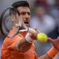 Serbia&#39;s Novak Djokovic returns the ball against Gael Monfils, of France, during their match at the Mutua Madrid Open tennis tournament in Madrid, Spain, Tuesday, May 3, 2022. (AP Photo/Manu Fernandez)