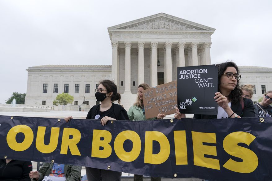 Demonstrators protest outside of the U.S. Supreme Court Tuesday, May 3, 2022 in Washington. A draft opinion suggests the U.S. Supreme Court could be poised to overturn the landmark 1973 Roe v. Wade case that legalized abortion nationwide, according to a Politico report released Monday. Whatever the outcome, the Politico report represents an extremely rare breach of the court's secretive deliberation process, and on a case of surpassing importance. (AP Photo/Jose Luis Magana)