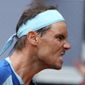Rafael Nadal of Spain celebrates a winning point against Miomir Kecmanovic of Serbia during their match at the Mutua Madrid Open tennis tournament in Madrid, Spain, Wednesday, May 4, 2022. (AP Photo/Paul White)