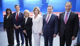 Kathy Barnette, Mehmet Oz, moderator Greta Van Susteren, Carla Sands, David McCormick, and Jeff Bartos, (left to right) pose for photo before they take part in a debate for Pennsylvania U.S. Senate Republican candidates, Wednesday, May 4, 2022, in Grove City, Pa. (AP Photo/Keith Srakocic)