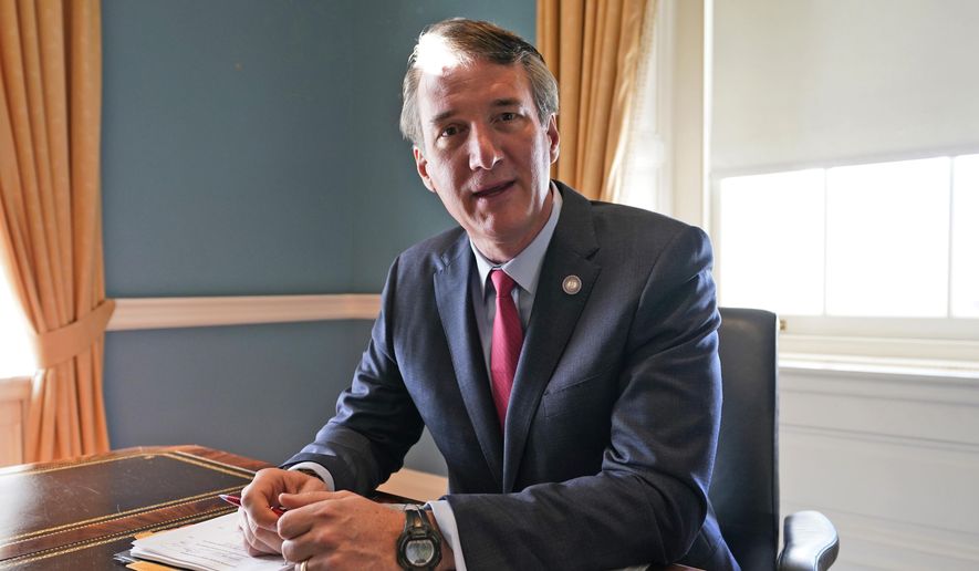 Virginia Gov. Glenn Youngkin works in the old Governor&#39;s office at the Capitol Wednesday, March 2, 2022, in Richmond, Va., in this file photo. (AP Photo/Steve Helber, File)