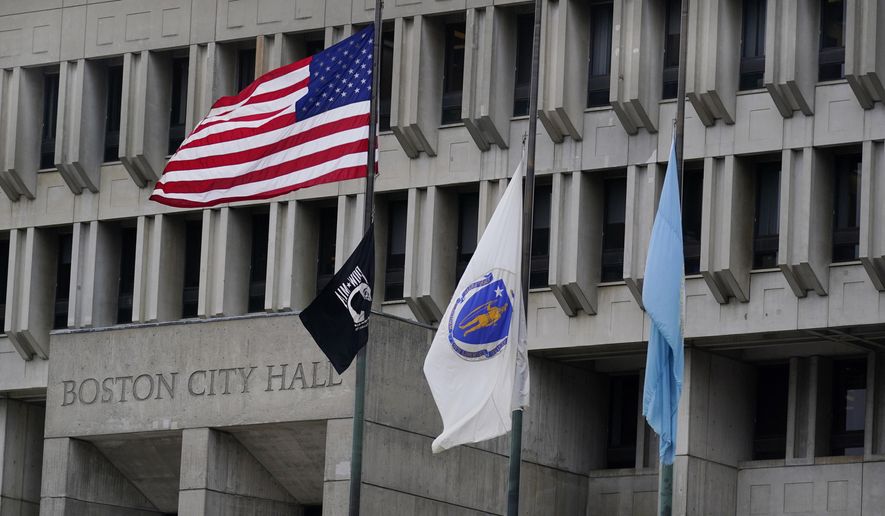 The American flag, the Commonwealth of Massachusetts flag, and the City of Boston flag, from left, fly outside Boston City Hall, Monday, May 2, 2022, in Boston. A unanimous Supreme Court has ruled that Boston violated the free speech rights of a conservative activist when it refused his request to fly a Christian flag on a flagpole outside City Hall. Justice Stephen Breyer wrote for the court Monday that the city discriminated against the activist because of his &quot;religious viewpoint,&quot; even though it had routinely approved applications for the use of one of the three flagpoles outside City Hall that fly the U.S., Massachusetts and Boston flags. (AP Photo/Charles Krupa)
