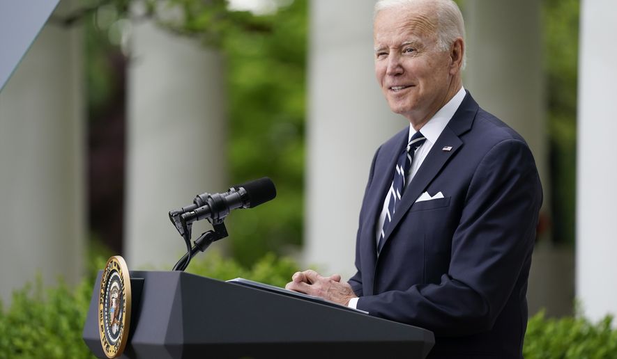 President Joe Biden speaks during a Cinco de Mayo event in the Rose Garden of the White House, Thursday, May 5, 2022, in Washington. First lady Jill Biden stands at right. (AP Photo/Evan Vucci)