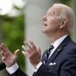 President Joe Biden looks to the sky as he speaks about the forecasted rain during a Cinco de Mayo event in the Rose Garden of the White House, Thursday, May 5, 2022, in Washington. First lady Jill Biden stands at right. (AP Photo/Evan Vucci)