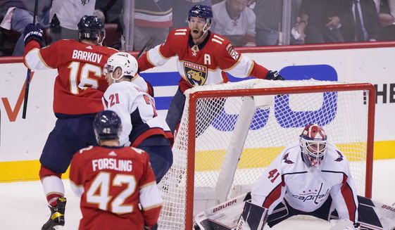 Florida Panthers center Aleksander Barkov (16) celebrates his goal with left wing Jonathan Huberdeau (11) during the first period of Game 2 of an NHL hockey first-round playoff series against the Washington Capitals,Thursday, May 5, 2022, in Sunrise, Fla. (AP Photo/Marta Lavandier)