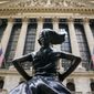 In this Aug. 25, 2020, file photo, the &#39;Fearless Girl&#39; bronze sculpture, commissioned by State Street Global Advisors, looks towards the New York Stock Exchange from its roadside perch in New York. Amid the push to get U.S. boardrooms to look more like companies’ customers and employees, advocates are finally seeing just how steep the task will be. Boards of directors at publicly traded U.S. companies are much more white and much less diverse than the overall population, often starkly so. (AP Photo/Bebeto Matthews, File)