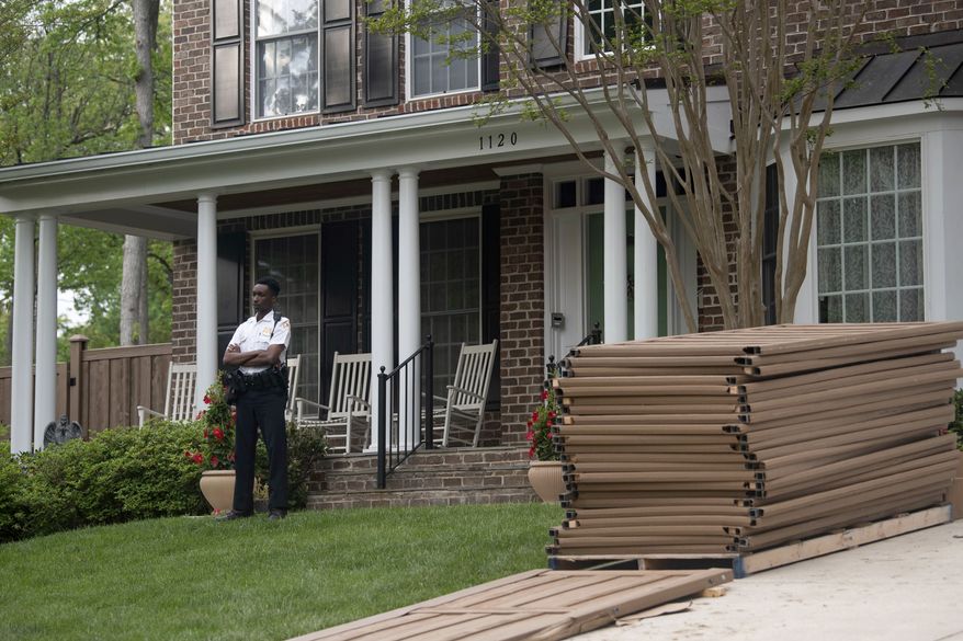 A U.S. Supreme Court Police officer stands outside the home of Justice Samuel Alito on Thursday, May 5, 2022, in Alexandria, Va. A draft opinion suggests the U.S. Supreme Court could be poised to overturn the landmark 1973 Roe v. Wade case that legalized abortion nationwide, according to a Politico report released Monday. Whatever the outcome, the Politico report represents an extremely rare breach of the court's secretive deliberation process, and on a case of surpassing importance. (AP Photo/Kevin Wolf)