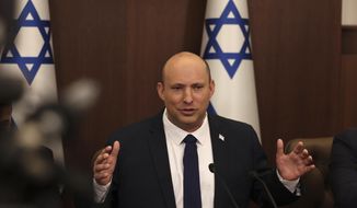 Israeli Prime Minister Naftali Bennett speaks during a weekly cabinet meeting in Jerusalem on Sunday, May 1, 2022. Bennett says he accepted an apology from Russian President Vladimir Putin for controversial remarks about the Holocaust made by Moscow’s top diplomat. But there was no mention of an apology in the Russian statement on Thursday, May 4,  call between the two leaders. (Menahem Kahana/Pool Photo via AP, File)