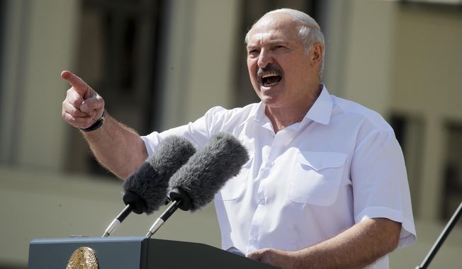 Belarusian President Alexander Lukashenko addresses his supporters gathered at Independent Square of Minsk, Belarus, Sunday, Aug. 16, 2020. (AP Photo/Dmitri Lovetsky, File)
