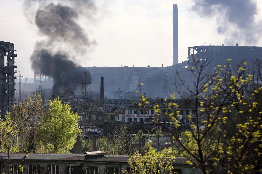 Smoke rises from the Metallurgical Combine Azovstal in Mariupol, in territory under the government of the Donetsk People's Republic, eastern Ukraine, Wednesday, May 4, 2022. (AP Photo/Alexei Alexandrov)