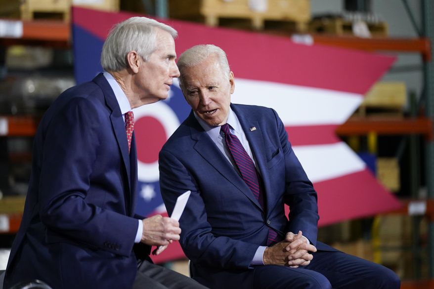 President Joe Biden speaks with Sen. Rob Portman, R-Ohio, at United Performance Metals in Hamilton, Ohio, Friday, May 6, 2022. (AP Photo/Andrew Harnik)