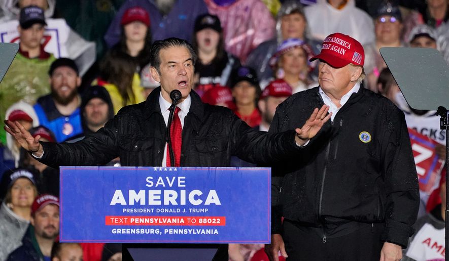Pennsylvania Senate candidate Mehmet Oz, left, accompanied by former President Donald Trump, speaks at a campaign rally in Greensburg, Pa., Friday, May 6, 2022. (AP Photo/Gene J. Puskar)
