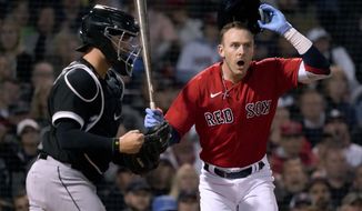 Boston Red Sox&#39;s Trevor Story reacts after being called out on strikes, next to Chicago White Sox catcher Reese McGuire (21) during the fifth inning of a baseball game at Fenway Park, Friday, May 6, 2022, in Boston. (AP Photo/Mary Schwalm)