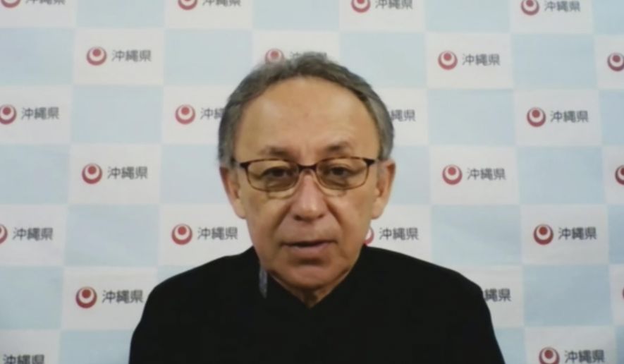 In this image made from video, Japan&#39;s southern island of Okinawa Gov. Denny Tamaki speaks online Friday, May 6, 2022, from the prefectural capital of Naha ahead Okinawa&#39;s 50th anniversary of its reversion to Japan on May 15. Japan should do more for peaceful diplomacy with China and not just focus on arms deterrence as tensions rise around Taiwan to the west of Okinawa, said the southern island prefecture&#39;s governor Friday, demanding further reduction of its security burden and its risk hosting U.S. military there. (Foreign Correspondents&#39; Club of Japan via AP)