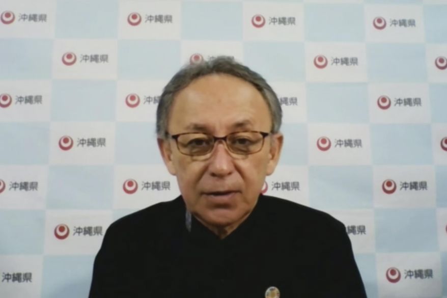 In this image made from video, Japan&#39;s southern island of Okinawa Gov. Denny Tamaki speaks online Friday, May 6, 2022, from the prefectural capital of Naha ahead Okinawa&#39;s 50th anniversary of its reversion to Japan on May 15. Japan should do more for peaceful diplomacy with China and not just focus on arms deterrence as tensions rise around Taiwan to the west of Okinawa, said the southern island prefecture&#39;s governor Friday, demanding further reduction of its security burden and its risk hosting U.S. military there. (Foreign Correspondents&#39; Club of Japan via AP)