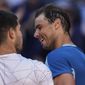 Spain&#39;s Rafael Nadal, right, congratulates Spain&#39;s Carlos Alcaraz after their match at the Mutua Madrid Open tennis tournament in Madrid, Friday, May 6, 2022. (AP Photo/Bernat Armangue)