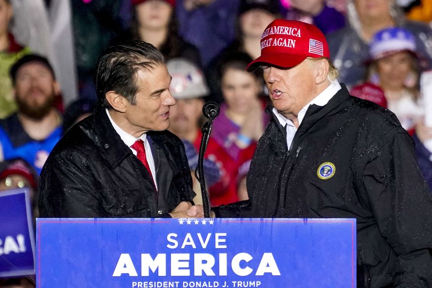 In this file photo, Pennsylvania Senate candidate Mehmet Oz, left, accompanied by former President Donald Trump, speaks at a campaign rally in Greensburg, Pa., Friday, May 6, 2022. (AP Photo/Gene J. Puskar) **FILE**
