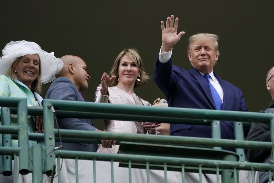 Former President Donald Trump waves to the crowd as he attends the 148th running of the Kentucky Derby horse race at Churchill Downs Saturday, May 7, 2022, in Louisville, Ky. (AP Photo/Mark Humphrey)
