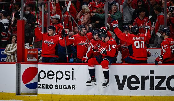 Washington Capitals players celebrate as T.J. Oshie ties the game at 1-1 against the Florida Panthers during Game 3 of the Stanley Cup playoffs at Capital One Arena in Washington D.C., May 7, 2022. (Photo by Brian Murphy, All-Pro Reels)