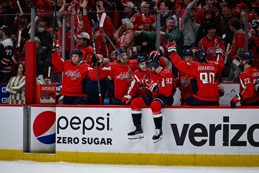 Washington Capitals players celebrate as T.J. Oshie ties the game at 1-1 against the Florida Panthers during Game 3 of the Stanley Cup playoffs at Capital One Arena in Washington D.C., May 7, 2022. (Photo by Brian Murphy, All-Pro Reels)