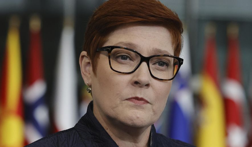 FILE - Australian Foreign Minister Marise Payne speaks with the media as she arrives for a meeting of NATO foreign ministers at NATO headquarters in Brussels on April 7, 2022. Payne said on Saturday, May 7, 2022 she met the Solomon Islands&#39; Development Planning and Aid Coordination Minister Jeremiah Manele in the Australian east coast city of Brisbane as he transited through the airport on Friday night. (AP Photo/Olivier Matthys, File)