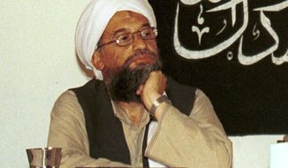 In this 1998 file photo made available Friday, March 19, 2004, Ayman al-Zawahri,  holds a press conference with Osama bin Laden (not seen) in Khost, Afghanistan.  Ayman al-Zawahri made an appearance in a pre-recorded video, Friday, May 6, 2022, to mark the 11th anniversary of the death of his predecessor Osama bin Laden.   The 27-minute speech was released Friday according to the SITE Intelligence group, which monitors militant activity. The leader appears sitting at a desk with books and a gun.   (AP Photo/Mazhar Ali Khan, File)