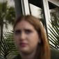 Eden Hebron, 19, describes the years of work she has done to cope with trauma and mental health effects after witnessing a gunman kill a close friend and two other students in Florida&#x27;s 2018 high school massacre in Parkland, during an interview with Associated Press journalists, Tuesday, March 8, 2022, in Hollywood, Fla. Hebron&#x27;s experience shows how many of the survivors have grappled with severe mental health issues that derailed their adolescence and greatly impacted their families.(AP Photo/Rebecca Blackwell)