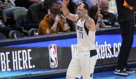 Dallas Mavericks guard Luka Doncic (77) walks off the court after he was called for a foul during the second half of Game 3 of an NBA basketball second-round playoff series against the Phoenix Suns, Friday, May 6, 2022, in Dallas. (AP Photo/Tony Gutierrez)