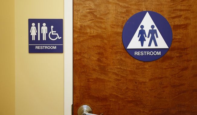 A gender neutral restroom is seen at the Downtown &amp; Vine Restaurant and Wine Bar, Monday, May 9, 2016, in Sacramento, Calif. (AP Photo/Rich Pedroncelli)