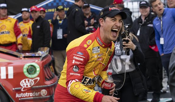 Joey Logano reacts in Victory Lane after winning a NASCAR Cup Series auto race at Darlington Raceway, Sunday, May 8, 2022, in Darlington, S.C. (AP Photo/Matt Kelley)