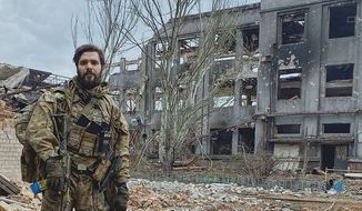 Azov Regiment Chief of Staff Maj. Bohdan Krotevych stands amid ruins leveled by Russian artillery and airstrikes in the strategic port city of Mariupol. He vowed to fight to the “last bullet” as his unit remains cut off from supplies and under siege by Russian forces. (Photo courtesy of Bohdan Krotevych.)