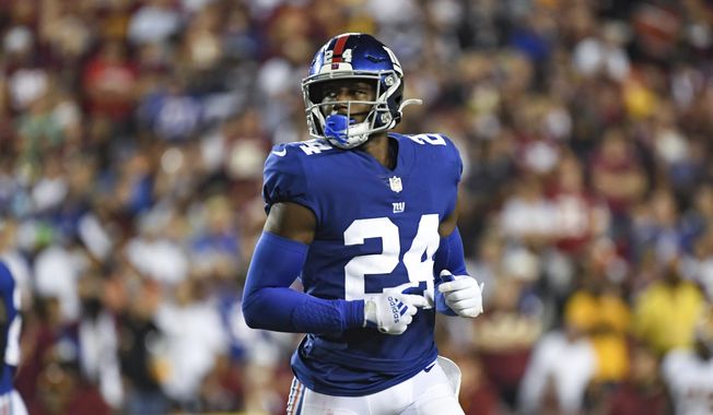 New York Giants cornerback James Bradberry (24) looks on between plays during the second half of an NFL football game against the Washington Football Team, Sept. 16, 2021, in Landover, Md. The Giants have released Bradberry. A starter for the team the last two seasons, including making the Pro Bowl in 2020, Bradberry is a salary cap casualty. He was due for a $21.9 million cap hit, so cutting him Monday, May 9, 2022 will save about $10 million. The team can designate him a post-June 1 release and save another $1.5 million on the cap for 2022. (AP Photo/Terrance Williams) **FILE***