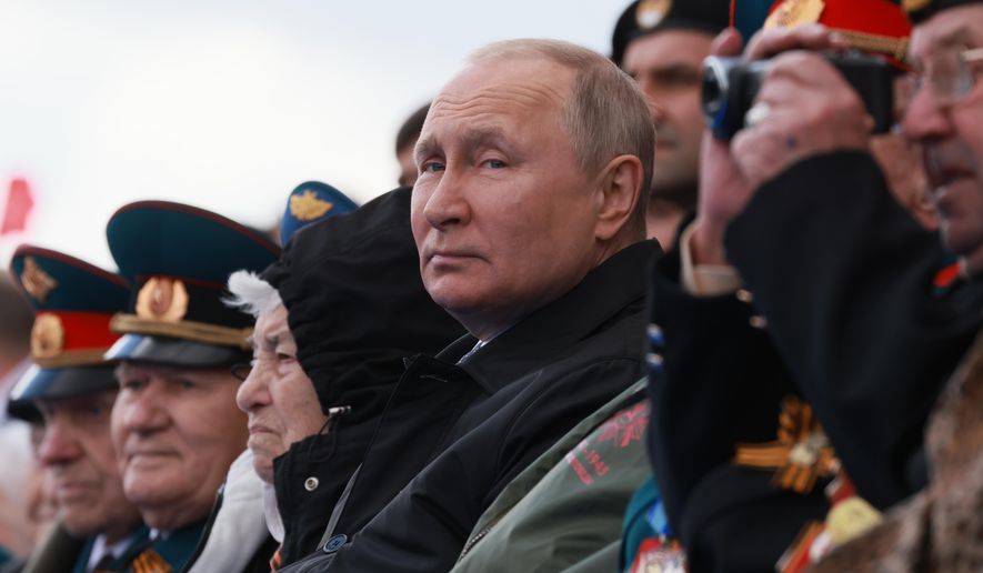 Russian President Vladimir Putin looks on during the Victory Day military parade marking the 77th anniversary of the end of World War II in Moscow, Russia, Monday, May 9, 2022. (Mikhail Metzel, Sputnik, Kremlin Pool Photo via AP)