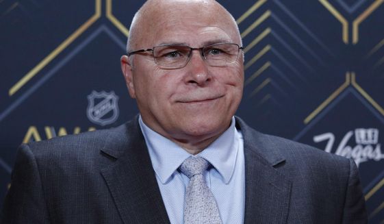 Barry Trotz of the New York Islanders poses on the red carpet before the NHL Awards, June 19, 2019, in Las Vegas. The New York Islanders have fired Barry Trotz after missing the playoffs in his fourth season with the team. General manager Lou Lamoriello made the surprising announcement Monday, May 9, 2022 more than a week after the regular season ended. Trotz had one year left on his five-year contract. (AP Photo/John Locher)