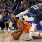 Phoenix Suns guard Chris Paul attempts to pass the ball as Dallas Mavericks&#39; Jalen Brunson (13) attempts to avoid colliding with him in the second half of Game 4 of an NBA basketball second-round playoff series, Sunday, May 8, 2022, in Dallas. (AP Photo/Tony Gutierrez) **FILE**