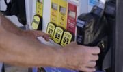 A customer pumps gas at a Shell gas station, Tuesday, May 10, 2022, in Miami. (AP Photo/Marta Lavandier)