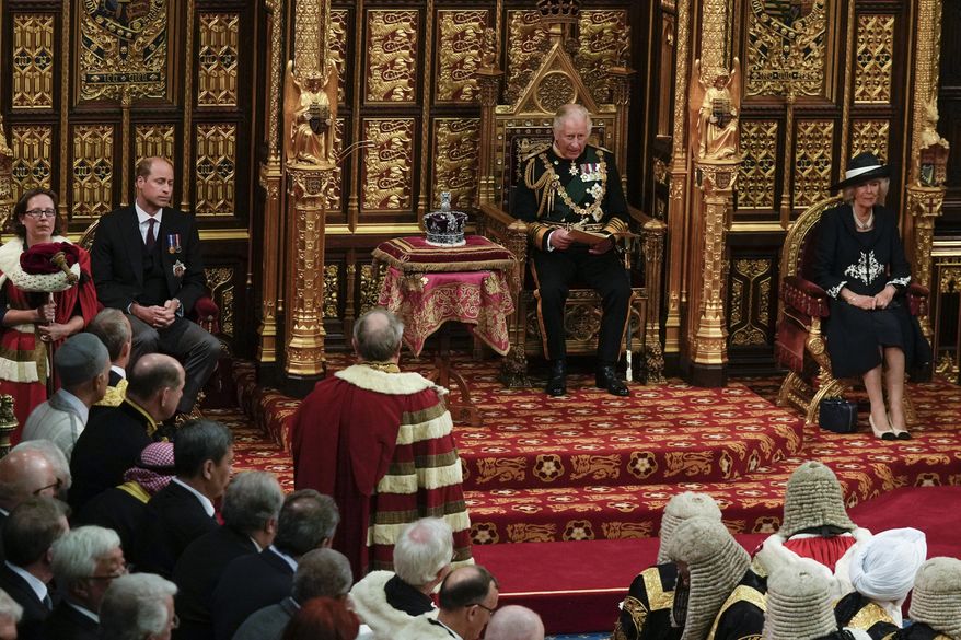 Prince Charles sits next to the Queen&#39;s crown during the State Opening of Parliament, at the Palace of Westminster in London, Tuesday, May 10, 2022. Queen Elizabeth II did not attend the opening of Parliament amid ongoing mobility issues. Prince William is seated second left, and Camilla Duchess of Cornwall is seated right. (AP Photo/Alastair Grant, Pool)