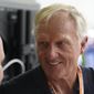 Professional golfer Greg Norman walks through the pit area during the third practice session for the Formula One Miami Grand Prix auto race at the Miami International Autodrome, Saturday, May 7, 2022, in Miami Gardens, Fla. (AP Photo/Darron Cummings) **FILE**