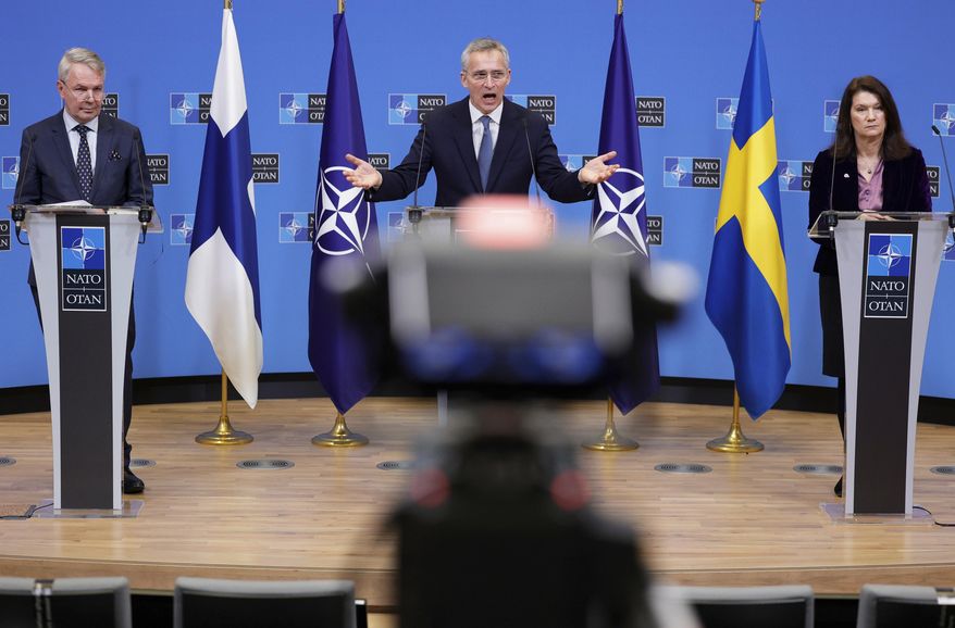 FILE - NATO Secretary General Jens Stoltenberg, center, participates in a media conference with Finland&#39;s Foreign Minister Pekka Haavisto, left, and Sweden&#39;s Foreign Minister Ann Linde, right, at NATO headquarters in Brussels, Jan. 24, 2022. The question of whether to join NATO is coming to a head in Finland and Sweden, where Russia&#39;s invasion of Ukraine has shattered the long-held belief that remaining outside the military alliance was the best way to avoid trouble with their giant neighbor. (AP Photo/Olivier Matthys, File)