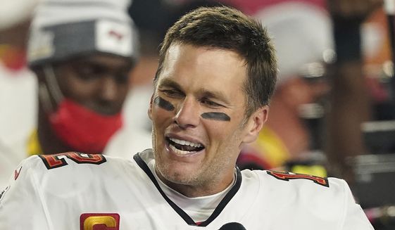 Tampa Bay Buccaneers quarterback Tom Brady (12) is interviewed on the field after the NFL Super Bowl 55 football game against the Kansas City Chiefs, in Tampa, Fla., Sunday, Feb. 7, 2021. (AP Photo/Steve Luciano, File)
